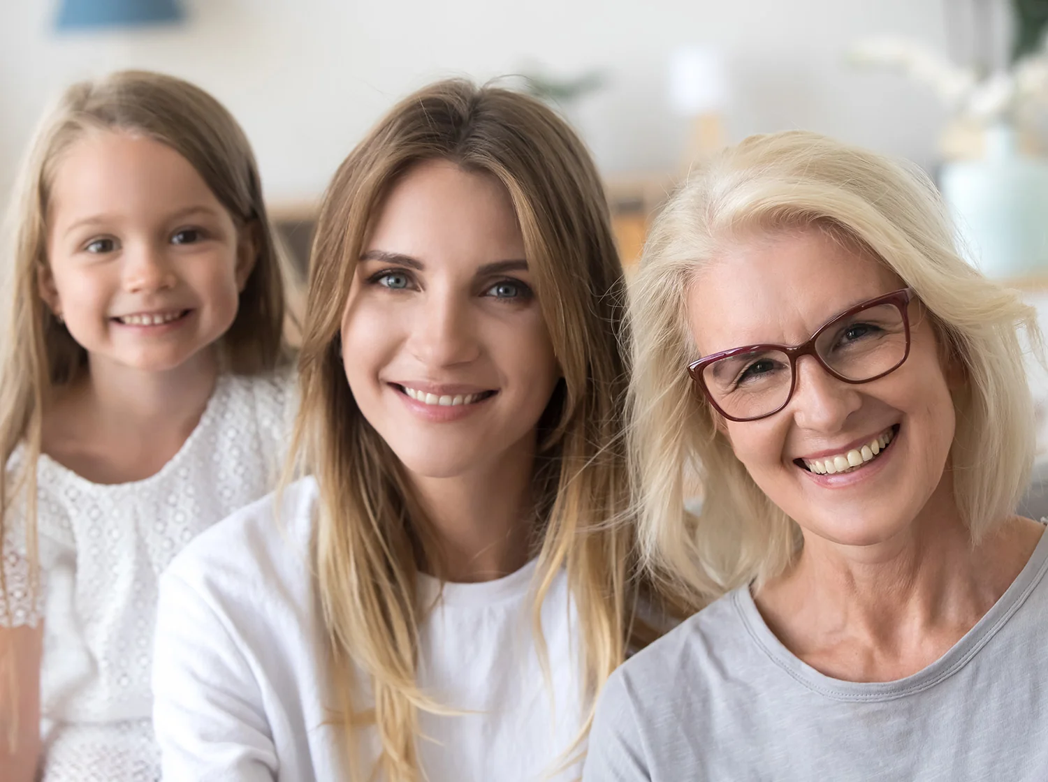 Three generations of a happy family indoors